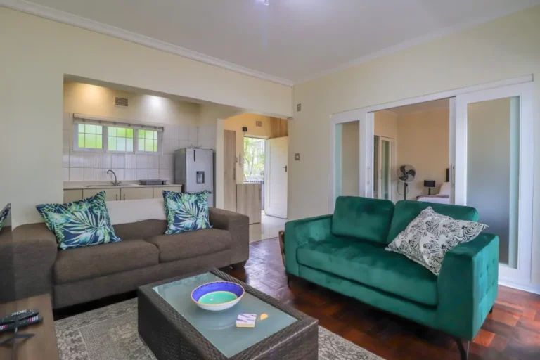 Cozy open-plan lounge and kitchen area at 2 Eaton Square