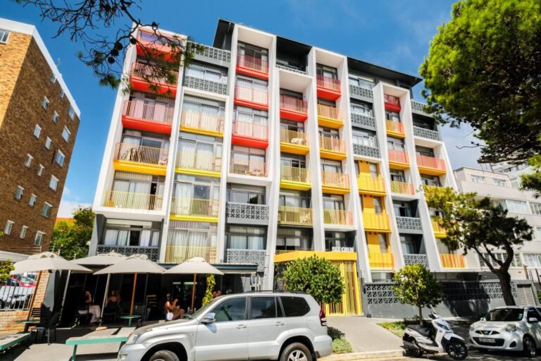 6 on N building exterior colorful balconies street café