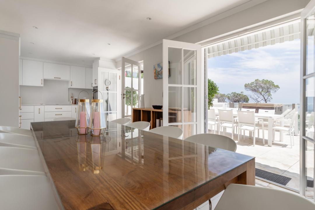 Open plan dining and kitchen area with seamless flow to outdoor terrace Villa Galazzio
