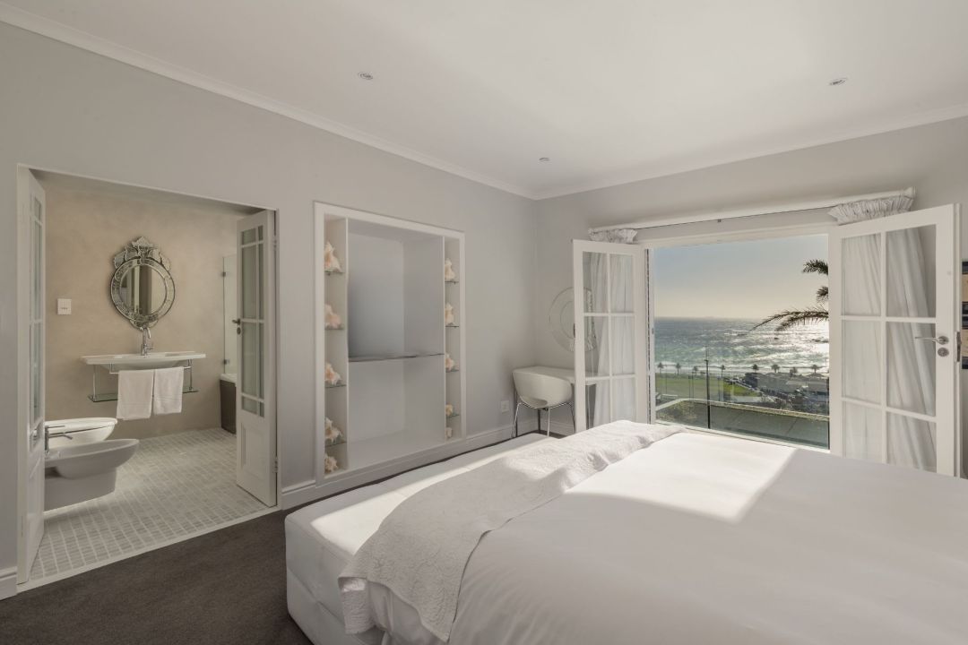 Elegant master bedroom with ocean view private balcony and en suite bathroom Villa Galazzio