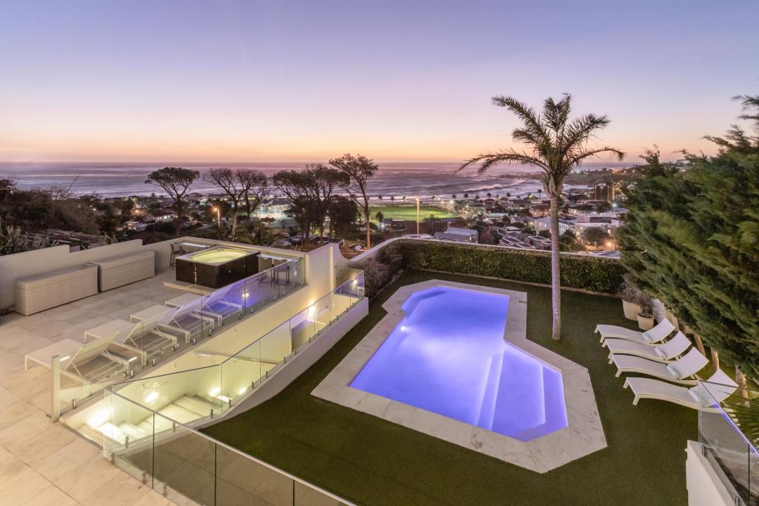 Luxury pool area with ocean sunset views jacuzzi and palm tree Villa Galazzio