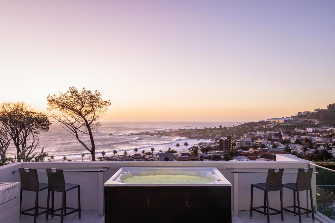 Sunset ocean view rooftop terrace with jacuzzi and bar seating Villa Galazzio