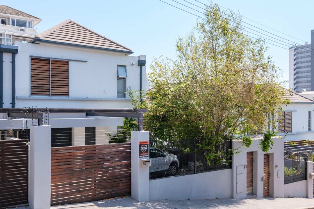 Secure and stylish street-facing exterior with wooden accents at Aureto