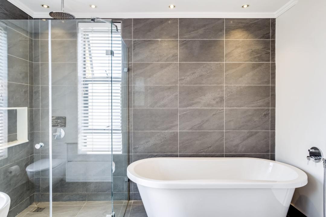 Luxurious bathroom with freestanding tub and walk-in shower at Aureto