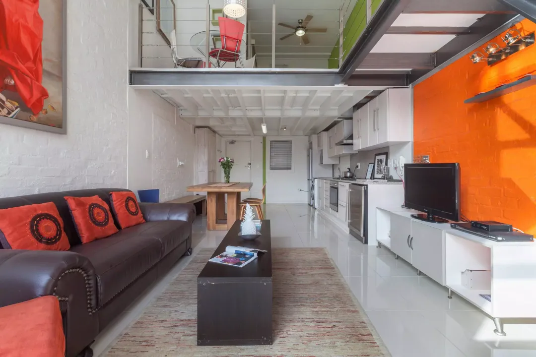 Trendy open-plan living area with mezzanine at 14 Harbour Terrace