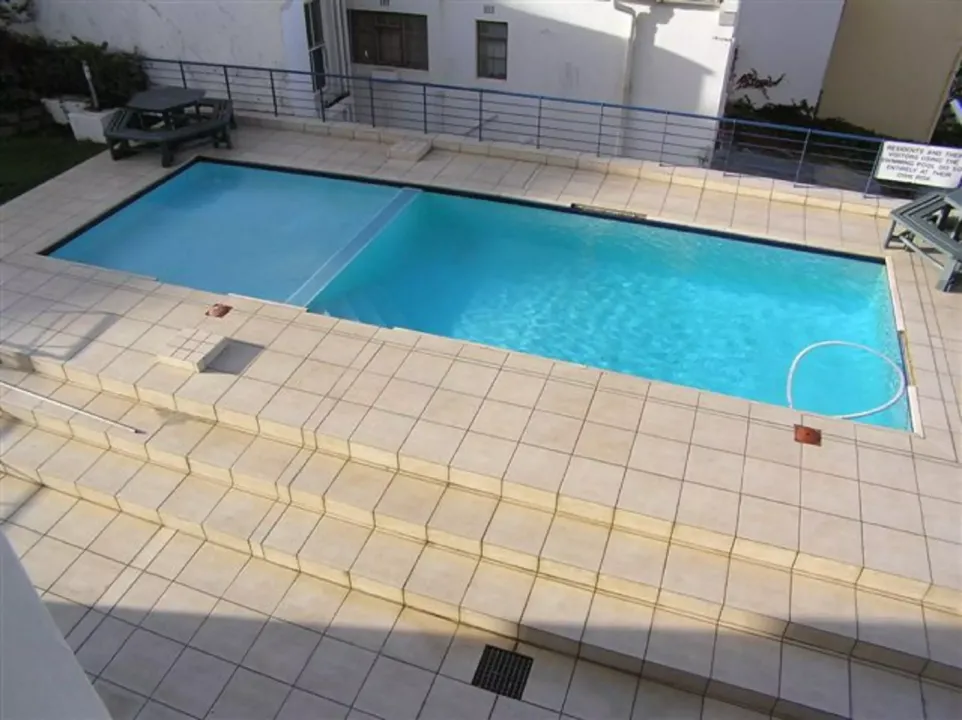 Shared swimming pool with sun terrace at 14 Harbour Terrace