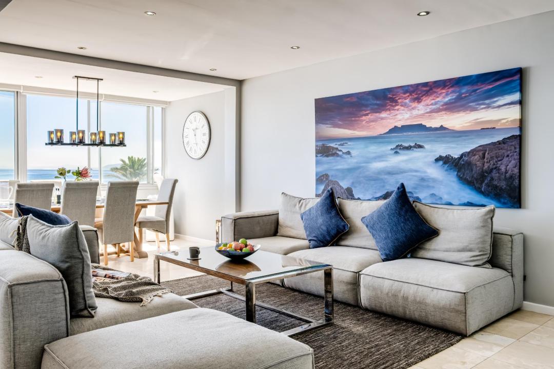 Chic open-plan lounge with ocean artwork and sea views at Atlantic Views