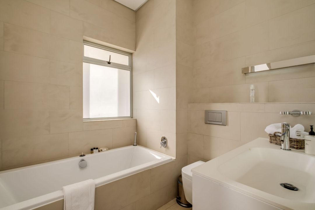 Soft-toned bathroom with soaking tub and natural light at Silvertree