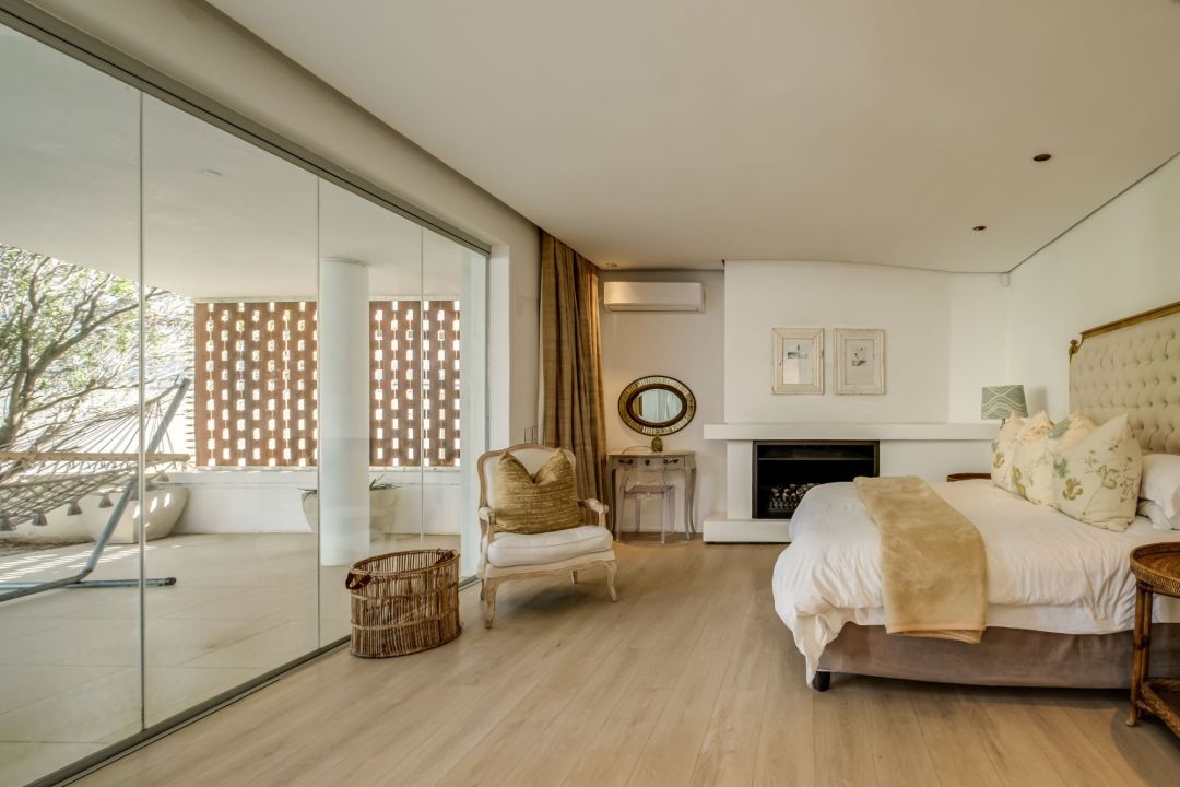 Spacious bedroom suite with fireplace and private terrace at Silvertree