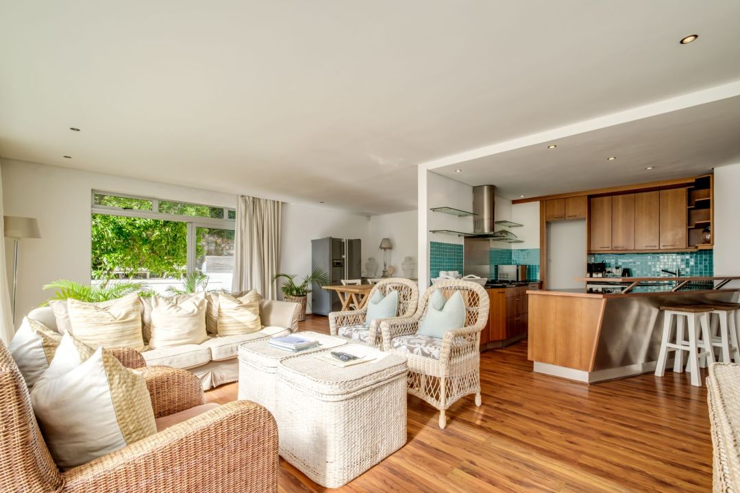 Airy open-plan living area with natural textures and garden views at Silvertree