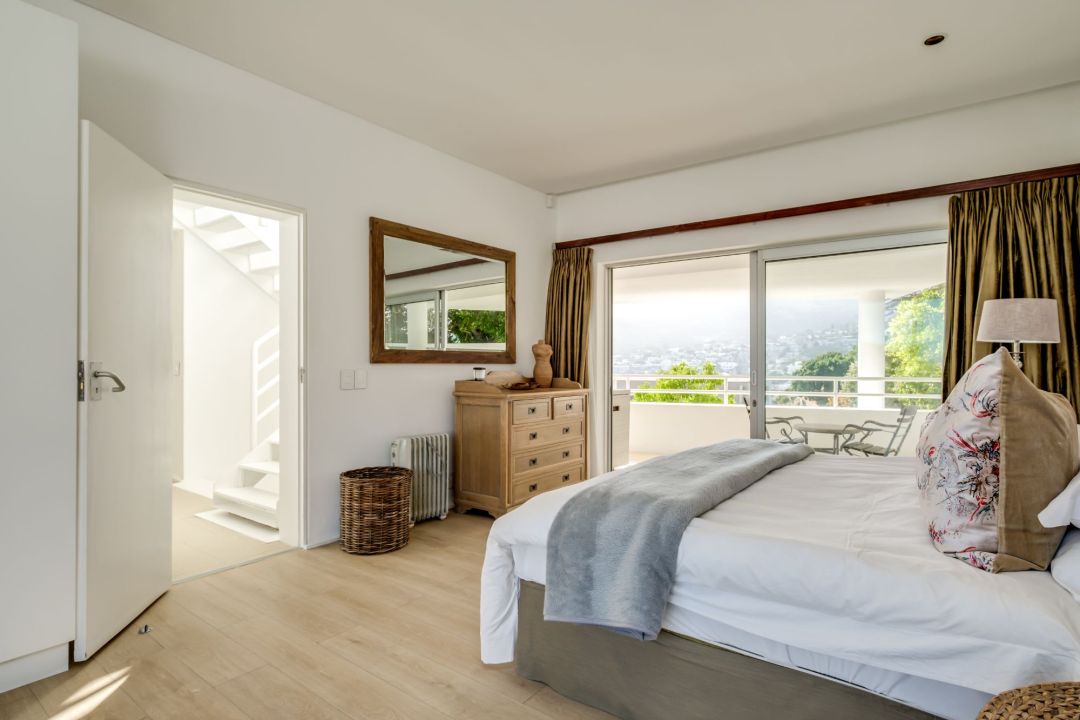 Bright bedroom with balcony access and elevated valley views at Silvertree