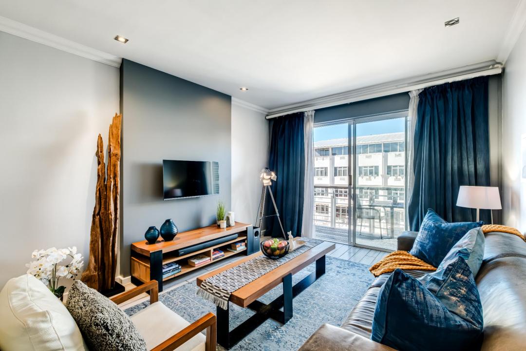 Modern lounge with bold accents and balcony access at Stonewood