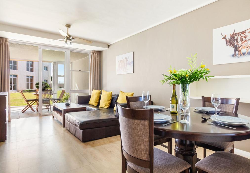 Open-Plan Living and Dining Area with Garden Access at Lagoon Beach 29A