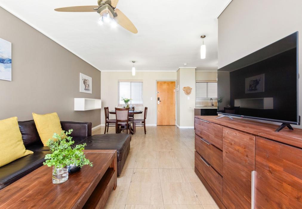 Comfortable Lounge with Warm Wood Finishes and TV at Lagoon Beach 29A