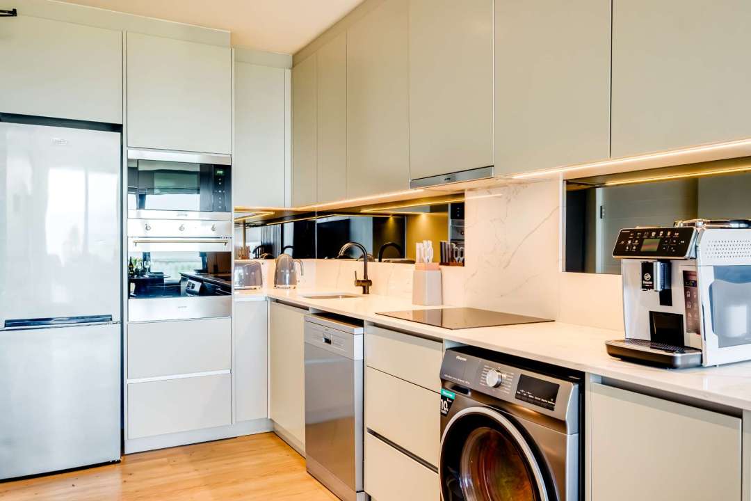 Fully equipped modern kitchen with built-in appliances at Marula One