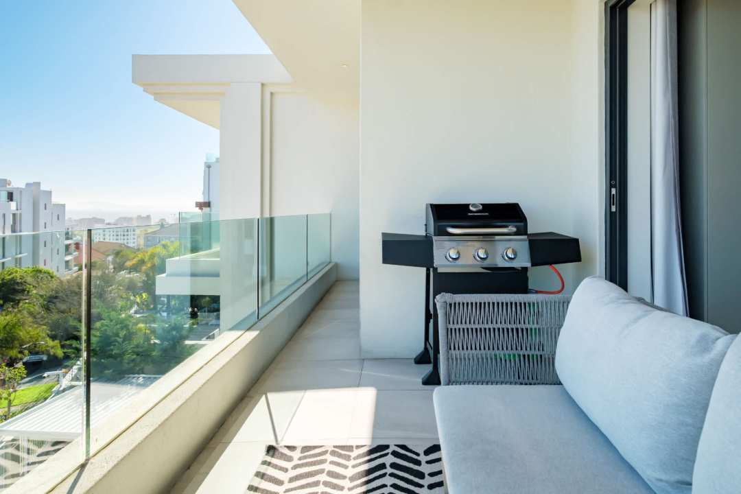 Private balcony with gas BBQ and city views at Marula One