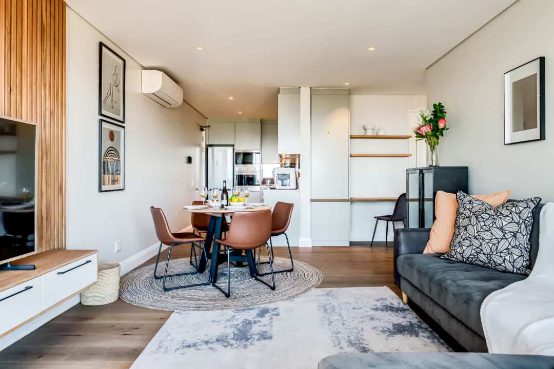 Open-plan living and dining area with contemporary finishes at Marula One