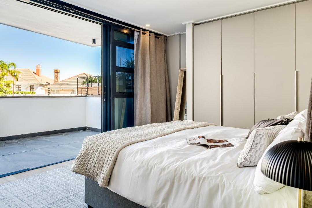 Chic bedroom opening onto private terrace at Bantry Suite