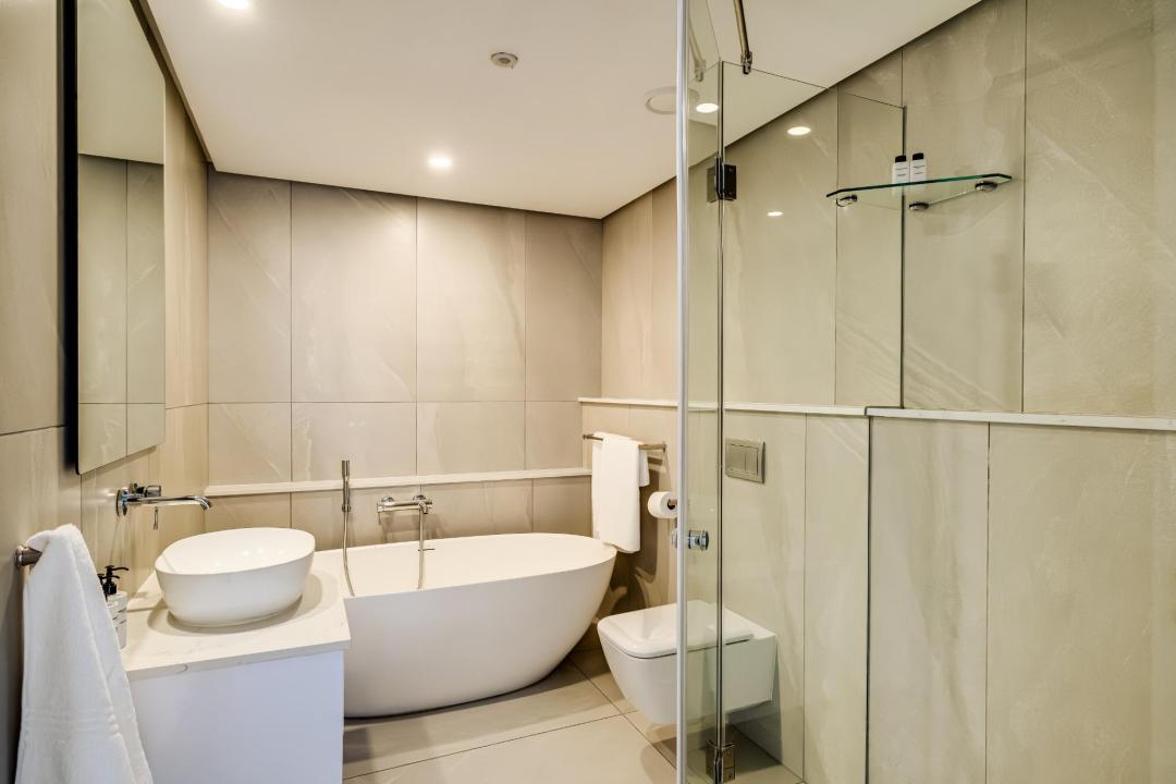 Elegant bathroom with freestanding tub and walk-in shower at Bantry Suite