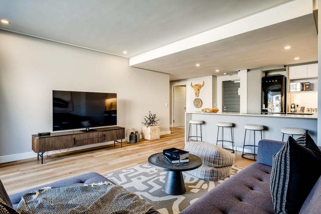 Spacious open-plan lounge with bar counter at Bantry Suite