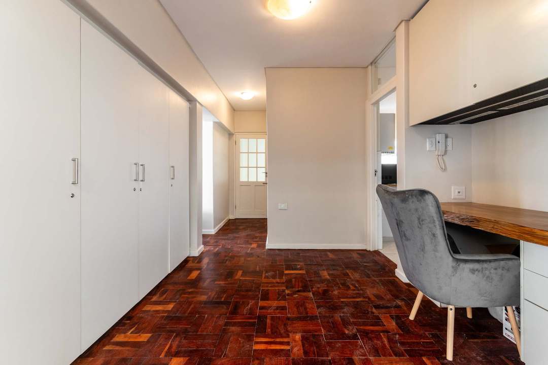 Spacious hallway with built-in storage and work desk at Caprice Bay