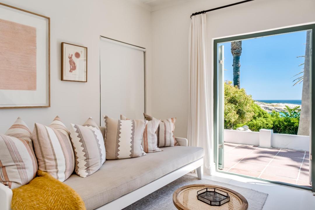 Serene lounge opening to sea-view terrace at Solmara