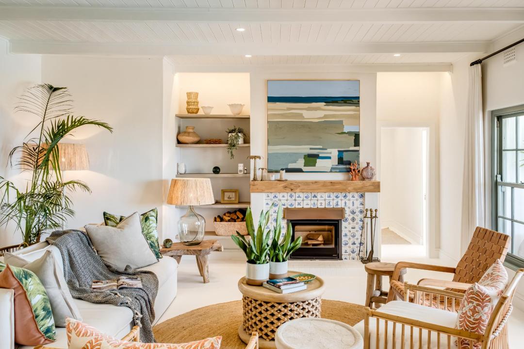 Stylish coastal-inspired living room with fireplace at Solmara