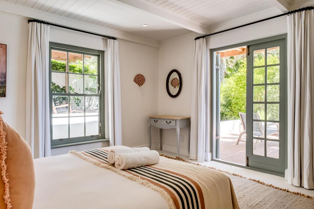 Charming garden-view bedroom with French doors at Solmara