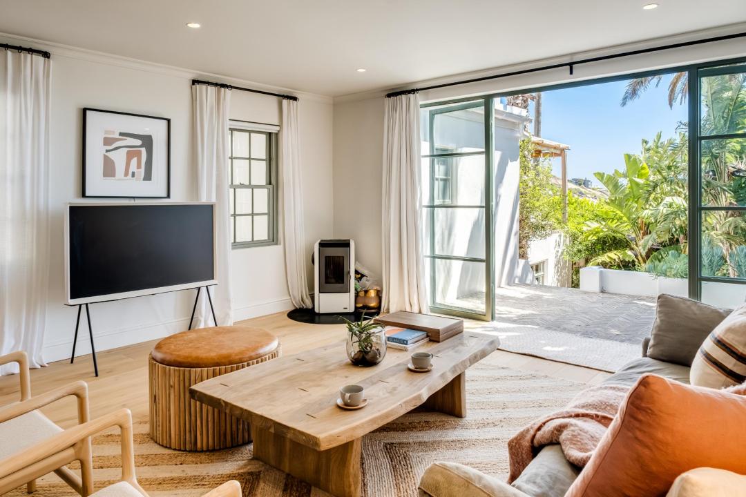 Modern lounge with garden views and terrace access at Solmara