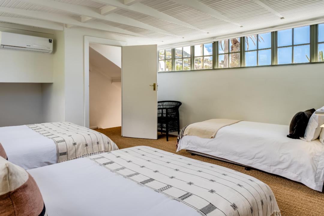 Bright triple bedroom with natural textures at Solmara