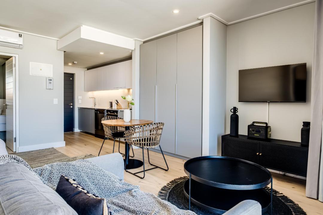 Modern studio-style living and dining space at Bantry Pad