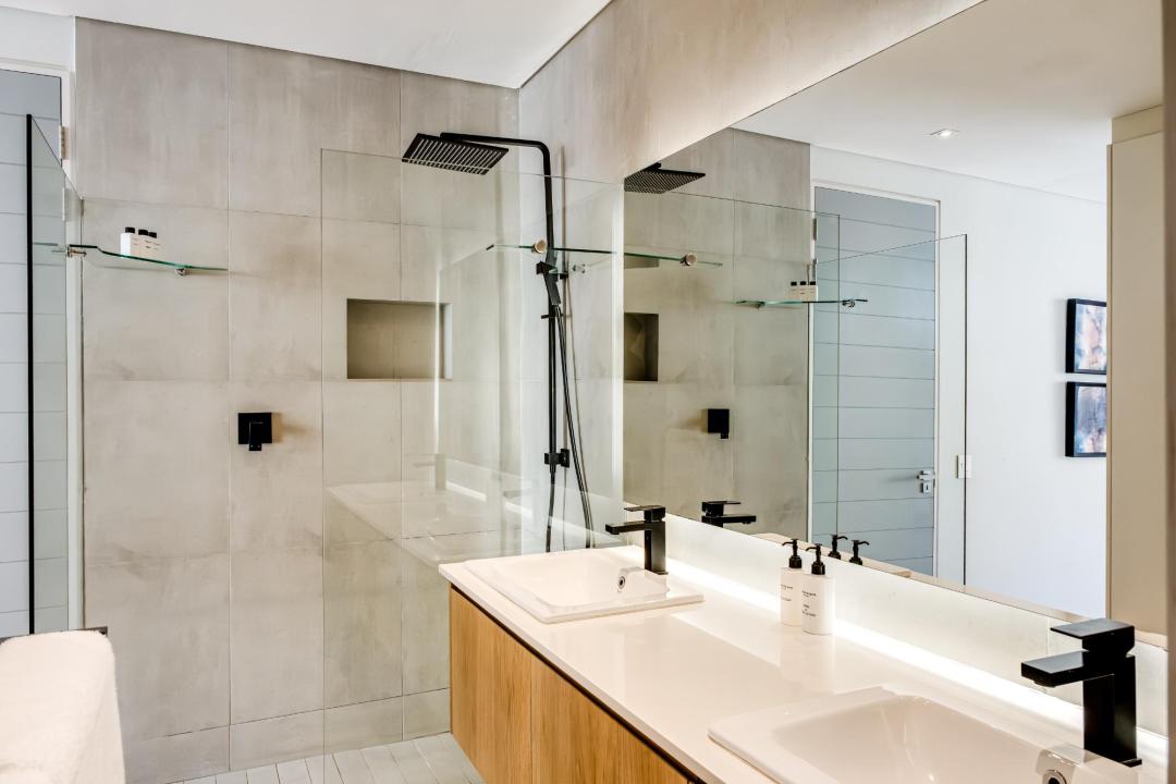 Sleek Walk-In Shower and Double Vanity Bathroom at Nobelium