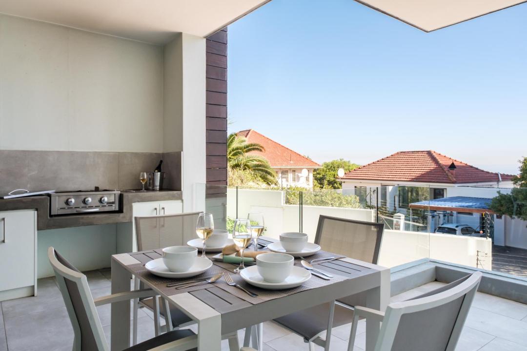 Covered Balcony with Outdoor Dining and Built-In Braai at Nobelium