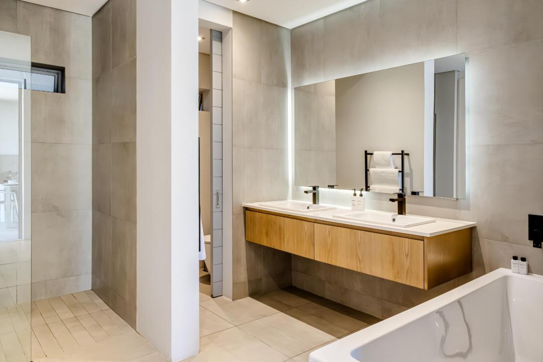 Spacious Modern Bathroom with Double Vanity and Sleek Finishes at Nobelium