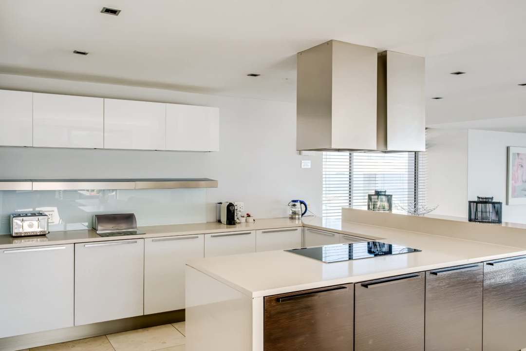 Sleek designer kitchen with high-end appliances at Blue Ocean Penthouse